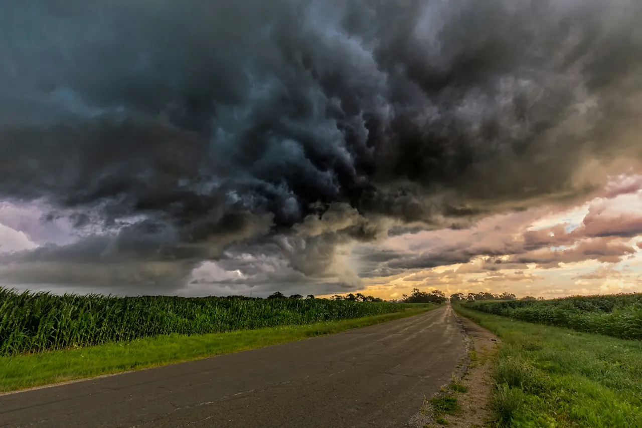 Roof Replacement in Elizabeth — storm clouds over a country road